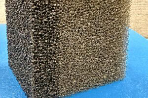 Reticulated polyurethane foam structure